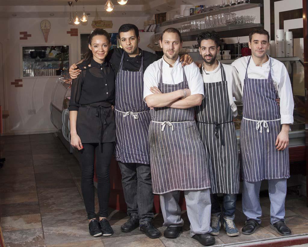 Anima E Cuore team stand together in aprons