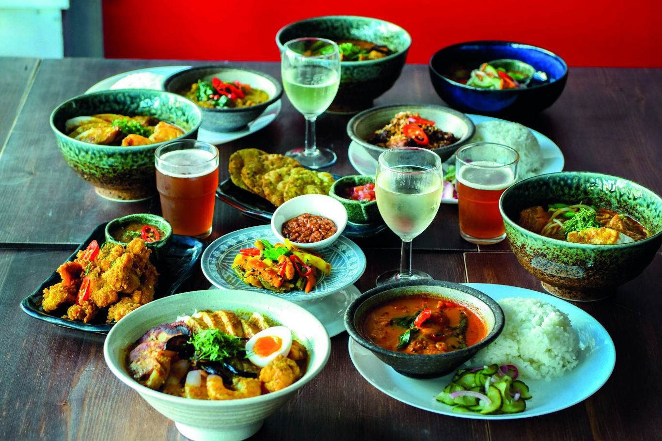 Plates of asian food in Sambal Shiok